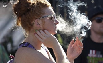 A woman smokes a joint at the High Times U.S. Cannabis Cup in Seattle