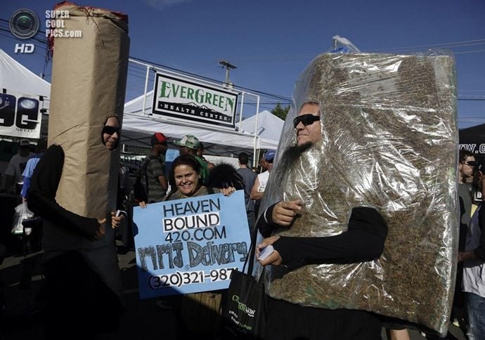 Members of a medical marijuana delivery service promote their business at the High Times U.S. Cannabis Cup in Seattle